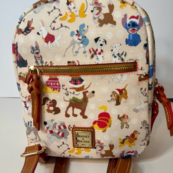 Dooney & Bourke Handbags - NWT. Disney Dogs Dooney & Bourke Bag - Santa Tails Backpack. Disney leather bag